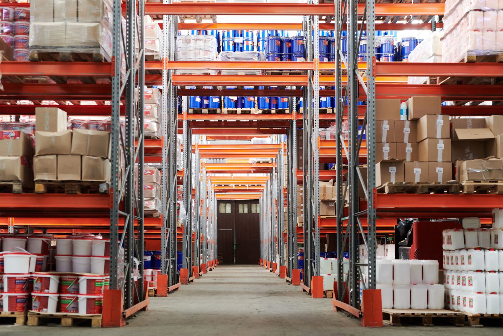 Warehouse aisle with pallet racking and stored goods